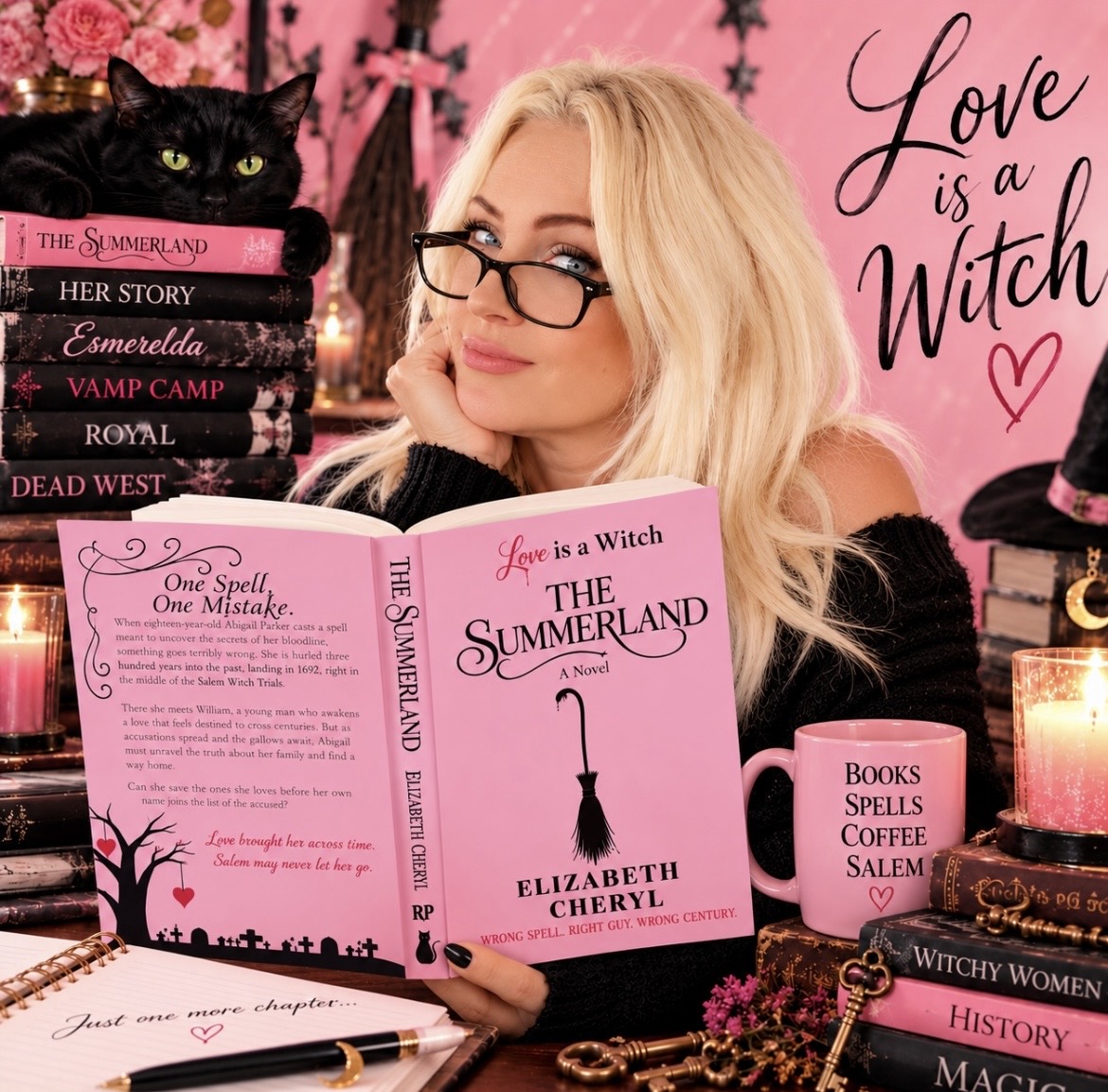 Elizabeth Cheryl holding The Summerland, with her cat and other books